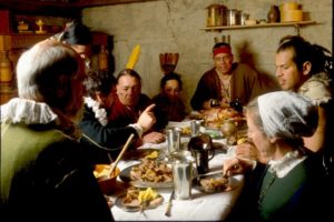 While many paintings of “the First Thanksgiving” show a single long table with several Pilgrims and a few Native people, there were actually twice as many Wampanoag people as colonists. It is unlikely that everyone could have been accommodated at one table. Rather, Wampanoag leaders like Massasoit and his advisors were most likely entertained in the home of Plymouth Colony’s governor, William Bradford. 
